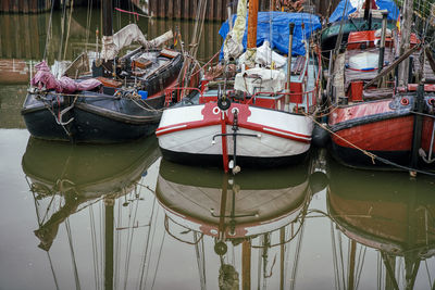 Fishing boats moored in harbor