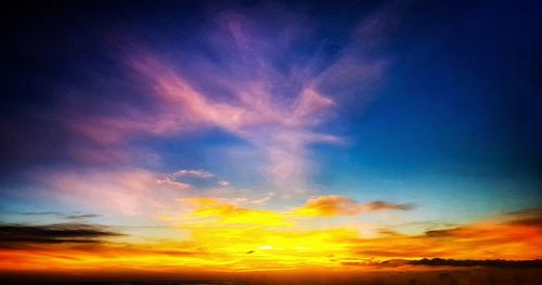 Low angle view of dramatic sky during sunset