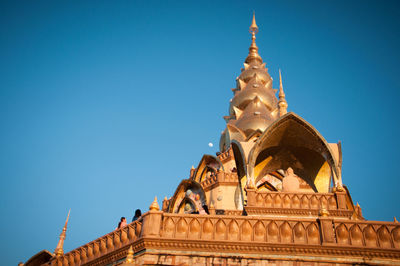 Low angle view of temple building against blue sky