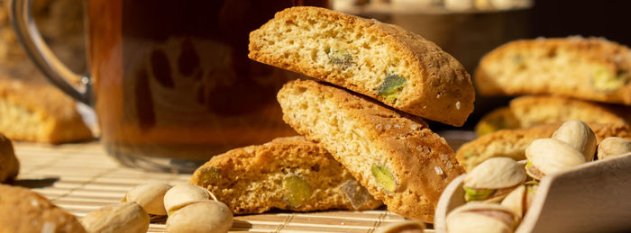 Biscotti cantuccini cookie biscuits with pistachios and lemon peel shortbread. cup of tea. teatime