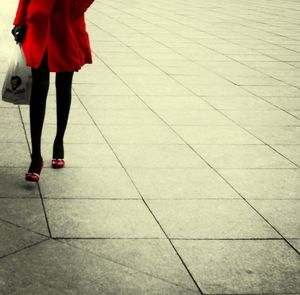 Low section of woman standing on floor