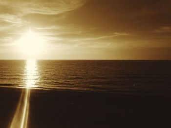 Scenic view of sea against sky at sunset