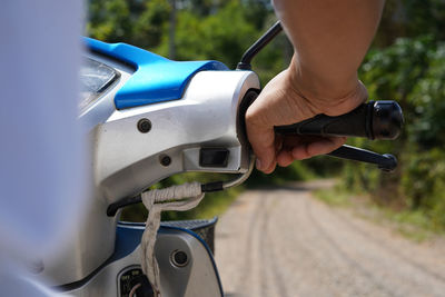 Close-up of man hand holding car