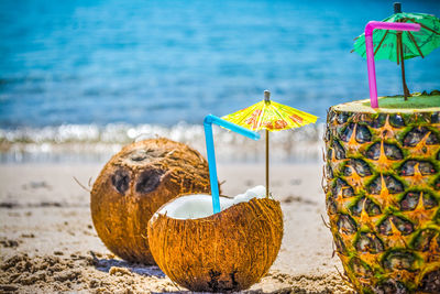 Close-up of cupcakes on beach