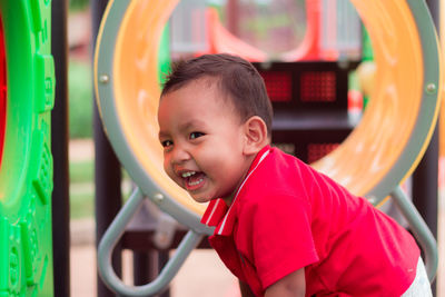 Portrait of cute boy playing in playground