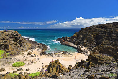 Relaxing and swimming in a beautiful protected bay at eternity beach aka halona cove on oahu, hawaii