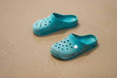 High angle view of shoes on sand