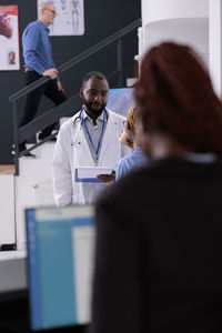 Doctor examining patient in clinic