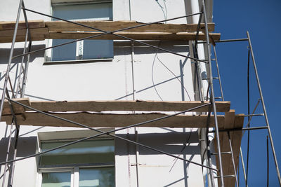 Low angle view of building against clear blue sky