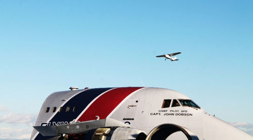 Low angle view of airplane flying in clear sky