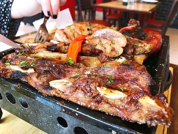 Close-up of meat on barbecue grill