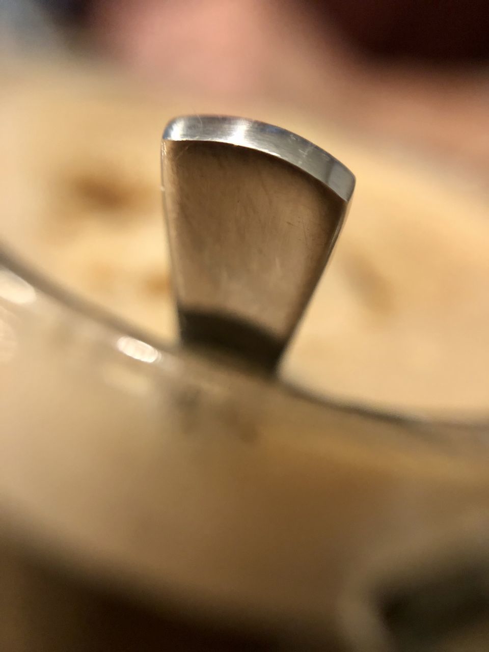 HIGH ANGLE VIEW OF COFFEE CUP ON METAL