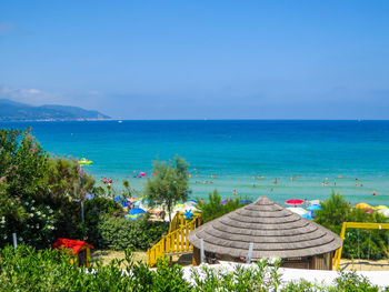 Scenic view of sea against blue sky