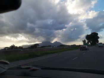 Cars on road seen through car windshield