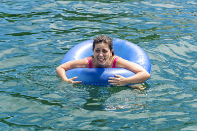 Portrait of woman swimming in sea