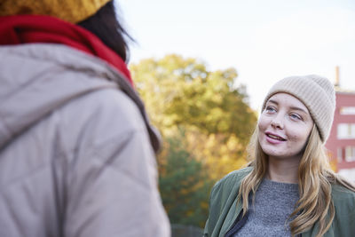 Women talking in autumn scenery