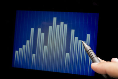 Close-up of hand holding blue