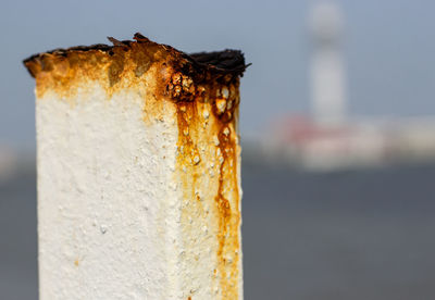 Close-up of rusty metal on wood