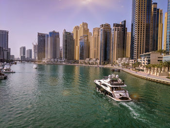 Panoramic view of sea and buildings against sky