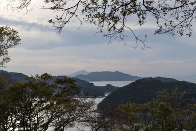 Scenic view of mountains and sea against sky