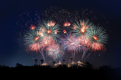 Firework display at night