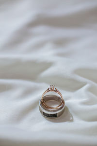 Close-up of wedding rings on textile