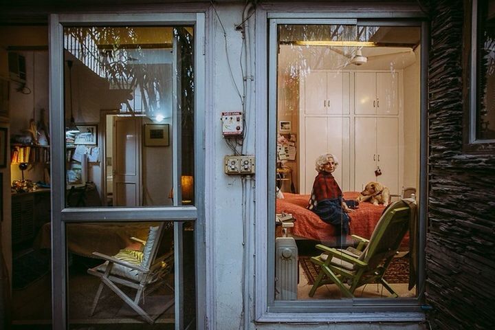 window, indoors, house, door, glass - material, curtain, home interior, built structure, closed, transparent, architecture, wood - material, open, doorway, reflection, day, one person, domestic room, entrance, chair