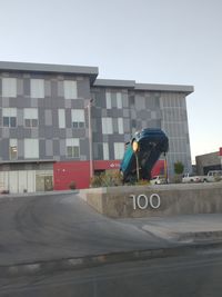 Man on street against buildings in city