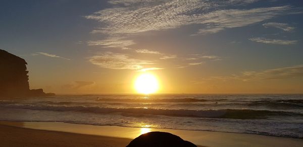 Scenic view of sea against sky during sunset