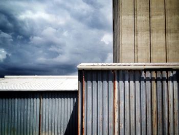 Low angle view of built structure against cloudy sky