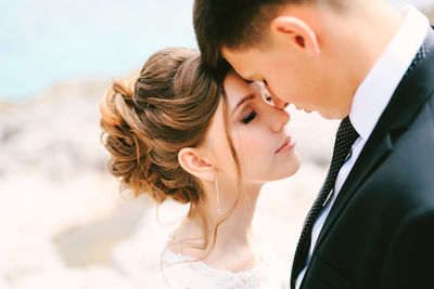 Side view of young woman looking away