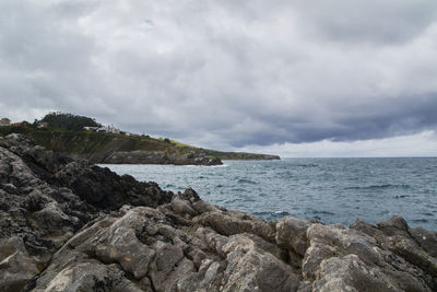 Rocky beach with gray clouds after the storm. colors of nature