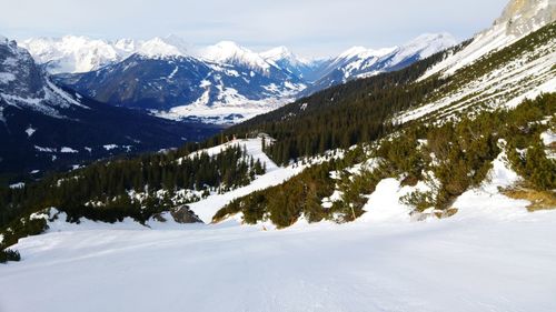 Scenic view of snow covered mountains