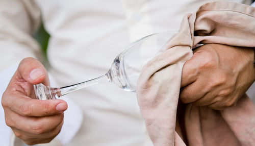 Close-up of man holding hands