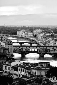 High angle view of river by buildings against sky