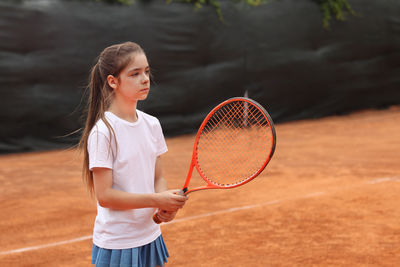 Young woman playing tennis