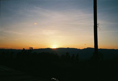 Scenic view of silhouette landscape against sky during sunset