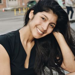 Close-up portrait of a smiling young woman