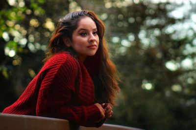 Portrait of young woman looking away in winter