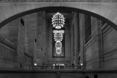 Low angle view of illuminated chandeliers hanging in grand central terminal