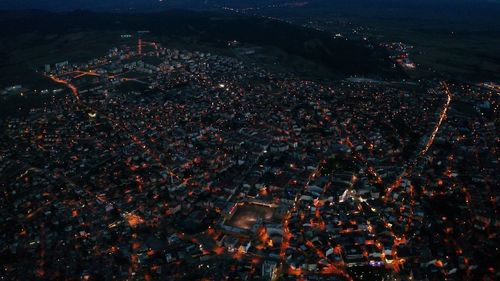 High angle view of illuminated cityscape at night