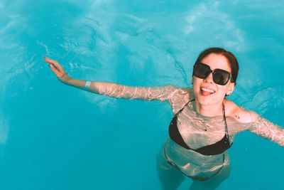 Young woman swimming in sea