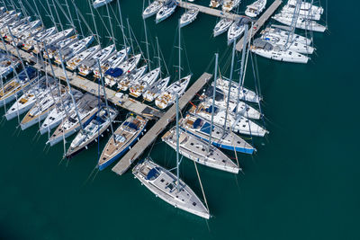 High angle view of sailboats moored at harbor