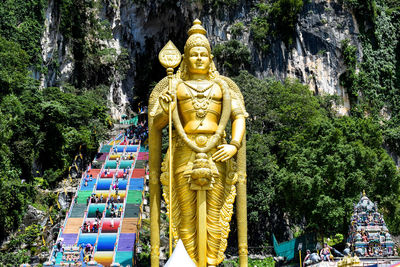 Statue of buddha against trees