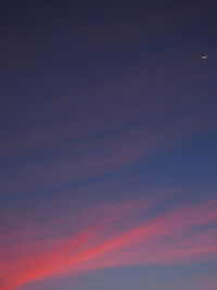 Low angle view of clouds in sky at sunset