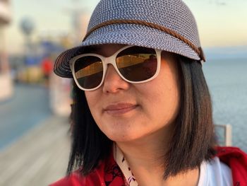 Close-up of woman wearing hat looking away