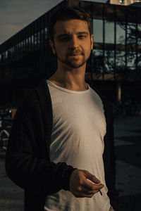 Portrait of young man standing outdoors