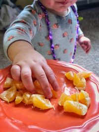 Close-up of hands holding fruit