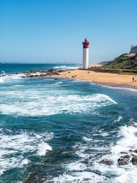 Durban south africa lighthouse by sea against clear blue sky