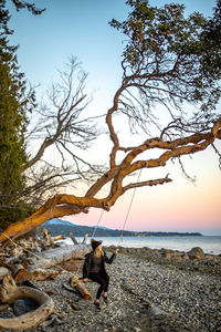 Full length of man on beach against sky